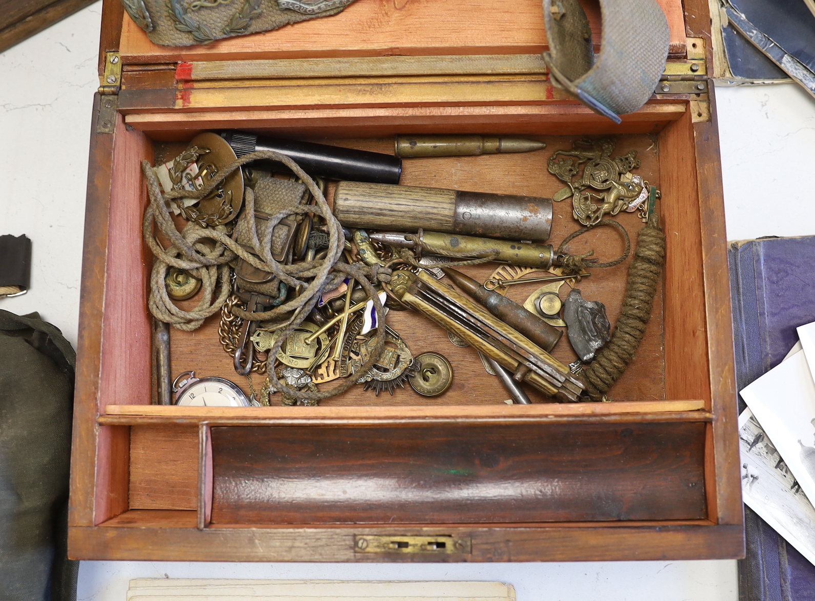 A quantity of war memorabilia including gas masks, postcards etc